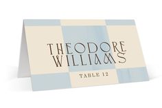 a blue and white table card with the words theodore williams on it