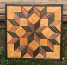 a wooden wall hanging on the side of a bench