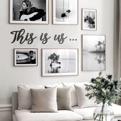 a living room filled with white furniture and pictures on the wall above it's coffee table