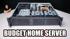 a man sitting at a table next to a server with the words budget home server on it