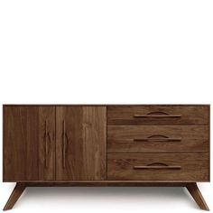 the sideboard is made from wood and has three drawers, one with two doors