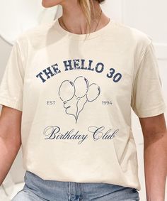 This custom classic crewneck t-shirt available in neutral colors is the perfect option for celebrating your milestone birthday. Be sure to enter your personalization in the box above: 1. Font Color choice from the numbered circles on the shirt options, example: "Font Color 1"  2. Your top text, example: "The Hello 30" 3. Est Year, example: "1994" 4. Your bottom text, example: "Birthday Club"  This is made via direct to garment printing, the colors in your final shirt might vary slightly from the Basic Crew Neck T-shirt For Birthday, Birthday Merch, Hello 30, Birthday Club, Vintage College, Aesthetic Minimalist, Blank T Shirts, Milestone Birthday, College Style