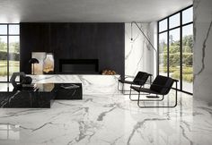 a modern living room with marble floors and walls