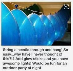 an image of some blue balloons hanging from a line