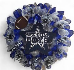 a wreath with footballs and bows on it