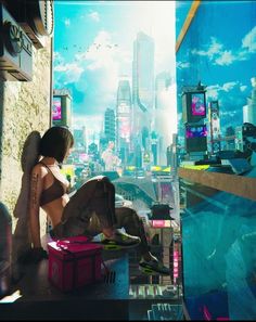 a woman sitting on top of a window sill looking out at a cityscape