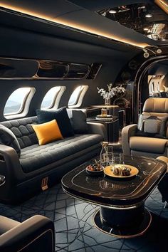 the inside of an airplane with couches, tables and chairs