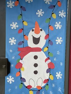 a door decorated with a snowman and christmas lights