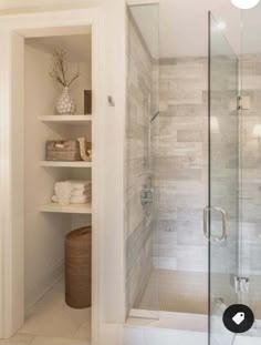 a walk in shower sitting inside of a bathroom