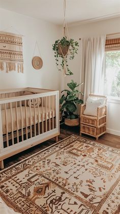 a baby's room with a crib, chair and rug