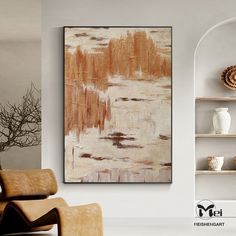 an abstract painting hangs on the wall in a living room