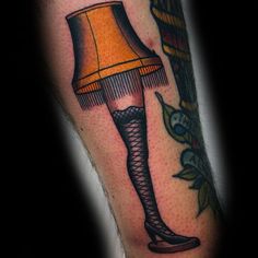 a woman's leg with a lamp on it and an orange shade in the middle