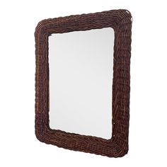 a mirror made out of wicker with a brown frame on the front and bottom