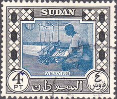 a stamp with an image of a man working on a weaving machine in arabic writing