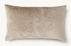 a beige pillow on a white background with no one in the room to see it