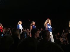 several models walking down the runway at a fashion show