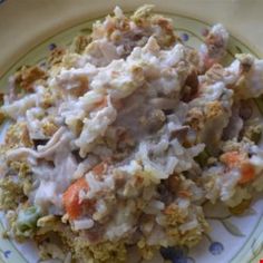 a close up of a plate of food with broccoli and chicken casserole