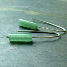 "Sterling silver modern minimalist open hoop dangles. Sterling silver handmade ear wires with mossy green aventurine cylinder beads. The soft green shades of the aventurine combines with the sterling silver for a sleek modern look. These aventurine open hoop earrings are approximately 1 1/4\" long. They come gift boxed and ready for giving (or keeping). ;) To get to my shop's main page: http://www.etsy.com/shop/ArtistiKat Thanks for shopping hand made.. PLEASE read shop policies prior to purchas Aventurine Earrings, Green Aventurine Stone, Ear Threader, Wire Jewelry Tutorial, Unique Jewelry Gifts, Diy Bracelet Designs, Open Hoop Earrings, Jewelry Techniques, Earrings Green