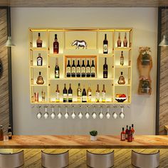 a bar with several bottles and glasses on the shelves, along with four stools