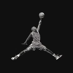 a black and white photo of a basketball player jumping in the air with a ball