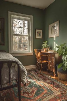 a bedroom with a bed, desk and plants in the corner on top of it