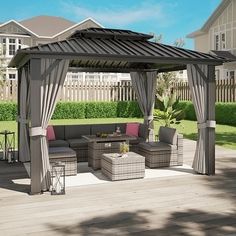 a gazebo sitting on top of a wooden deck