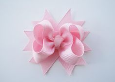 a pink bow on a white background