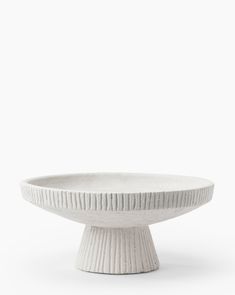 a white bowl sitting on top of a table