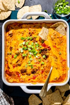 a casserole dish with tortilla chips and salsa