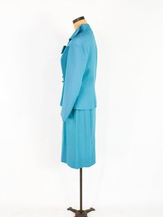 "~ 1950s Gorgeous turquoise blue wool crepe suit ~ This beautiful suit was my Mother's and only worn a few times. ~ Remembering Mom fondly as I'm finally ready to let the suit go ~ Matching decorative bow with rhinestones ~ Both front sides have sewn down pleats ~ Interesting collar & fitted waist ~ 4 covered buttons ~ Jacket has blue silk crepe lining ~ Skirt is half lined in taffeta ~ 7\" side metal zipper ~ Excellent Label: Lilli Ann, Luxurious Fabric of Paris, Loomed in Paris Jacket Bust Fitted Vintage Blue Set, Blue Fitted Vintage Set, Vintage Blue Skirt Suit For Formal Occasions, Blue Fitted Vintage Suit, Fitted Vintage Blue Suits, Vintage Fitted Blue Suits, Retro Fitted Blue Sets, Retro Blue Fitted Sets, 1950s Sweater