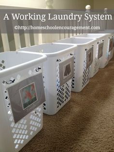 several laundry baskets lined up on the floor