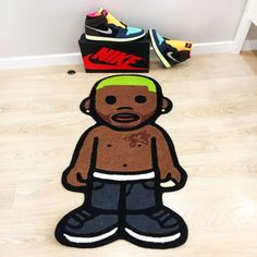 an image of a cartoon character on the floor with shoes in the corner behind it