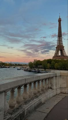 the eiffel tower towering over the city of paris, france at sunset or dawn