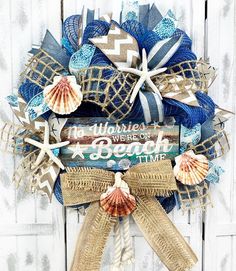 a wreath with seashells and starfish on it