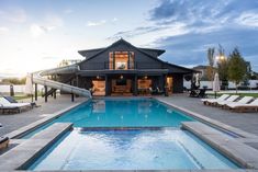 a house with a pool and slide in the backyard