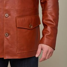 This rugged Safari Leather jacket is a vintage look that is sure to keep you warm while you brave the cold. Adorned with two upper pockets and two lower pockets, this piece enables you to pack as heavy or light in the cold as you like. Layer this Safari Jacket with a lightweight sweater or simple button down to achieve a dynamic look of western sophistication. Model is 6'1 and wearing size M. Rugged Leather Jacket With Pockets For Winter, Rugged Outerwear With Double-needle Stitching, Rugged Long Sleeve Outerwear With Double-needle Stitching, Utility Leather Jacket With Pockets, Brown Workwear Outerwear With Flap Pockets, Utility Leather Outerwear With Pockets, Classic Leather Outerwear With Patch Pockets, Brown Leather Jacket With Patch Pockets, Brown Outerwear With Pockets For Cold Weather