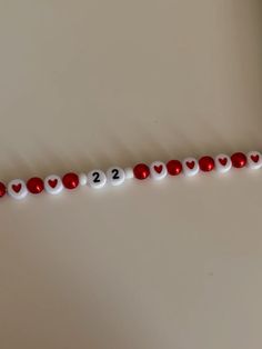 a red and white beaded garland with hearts