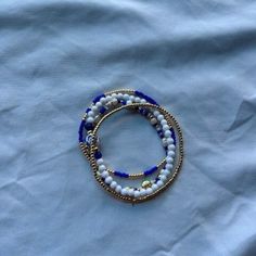 4 beautiful blue, white, and gold bracelets. Perfect to wear while swimming. Gold Bracelets, Infinity Necklace, Feeling Blue, Beautiful Blue, Porter, Jewelry Bracelets, Gold Bracelet, Blue White, Handmade Items