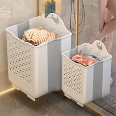 two bins that have clothes inside of them