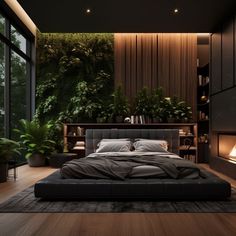 a large bed sitting in the middle of a bedroom next to a window with plants on it