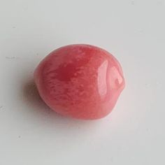 Dark Pink Flame Conch Pearl 5+ carats: Type of pearl: Conch Pearl   Weight: 5.56 carats   Shape: Oval   Size: 11 x 8.5 x 7mm   Color: Dark Pink with Flame - white spot on each end   Location Blue Mussel, Natural Pearl Jewelry, Pearl Farm, Basic Jewelry