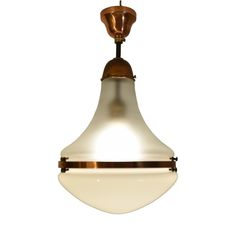 a light that is hanging from a ceiling fixture with a white background and gold trim