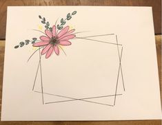 a piece of paper with a flower on it and some lines in the middle that have been drawn