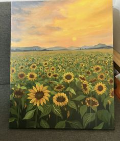 a painting of sunflowers in a field at sunset