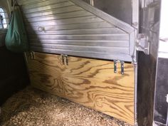 the inside of a horse trailer with wood paneling and metal rails on the side