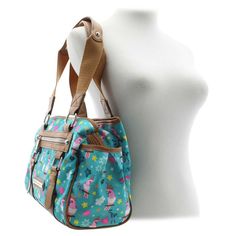 Embrace vibrant style with the Lily Bloom Parrots In Paradise Landon Satchel! This captivating bag features a colorful parrot and floral print that blossoms with color, adding a touch of whimsy and personality to your everyday look. This bag helps keep the environment green by using their signature KARMA BLOOM fabric that is made of recycled plastic bottles. Shop SHOE DEPT. ENCORE today.

synthetic upperparrot and floral-print designfabric material is signature KARMA BLOOM made from recycled pla Shop Shoe, Colorful Parrots, Vibrant Style, Lily Bloom, Watch Trends, Floral Print Design, Design Fabric, Shoe Show, Handbag Shoes