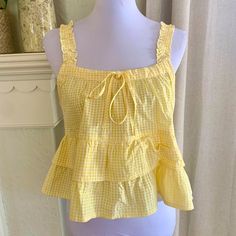 Cute Yellow Sleeveless Top, Cute Yellow Fitted Blouse, Yellow Ruffled Top For Brunch, Cute Yellow Spring Blouse, Yellow Sleeveless Top With Ruffles, Yellow Ruffled Top For Beach, Cute Yellow Summer Tops, Cute Yellow Top For Brunch, Yellow Ruffled Tops For Day Out