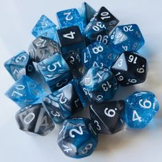 blue and black dice with white numbers on them