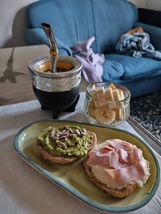 an open faced sandwich with avocado and ham on it