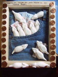 there are some fake white fish in the pocket of a blue jean jacket with penn bills sticking out of it